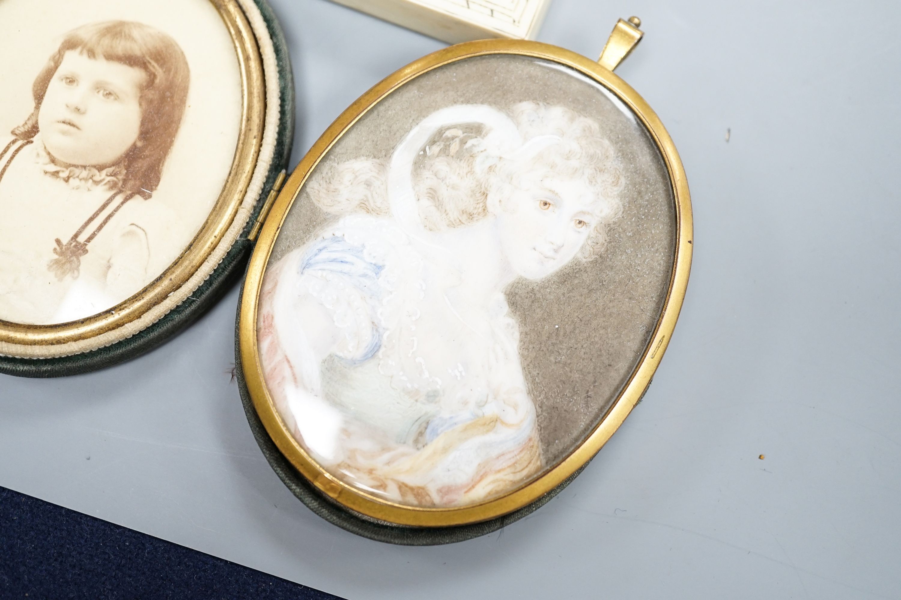 A paste and enamel framed Portrait miniature on ivory, 9.2cm and four other portrait miniatures (three on ivory)